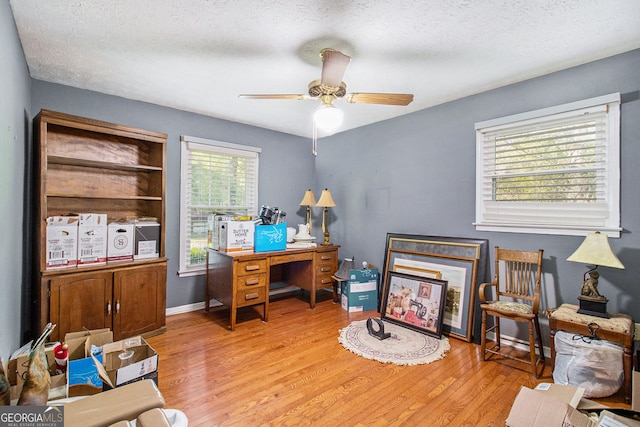 office with wood finished floors, a ceiling fan, and a textured ceiling