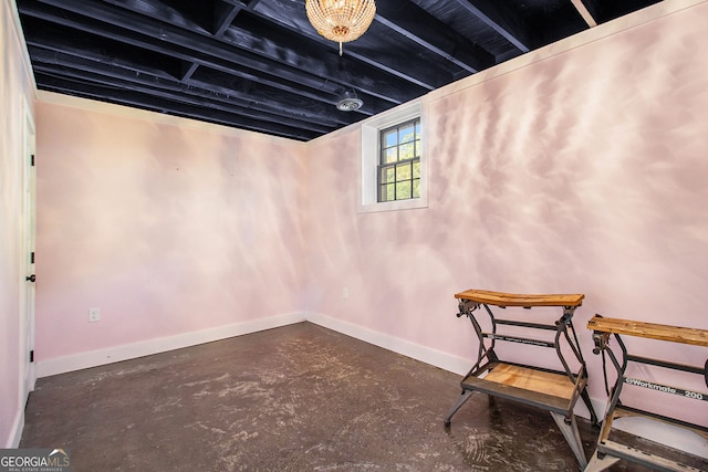 below grade area featuring baseboards