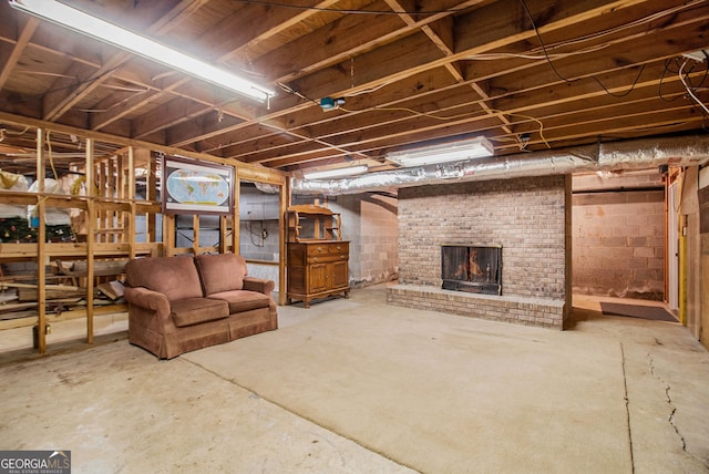unfinished below grade area with a fireplace