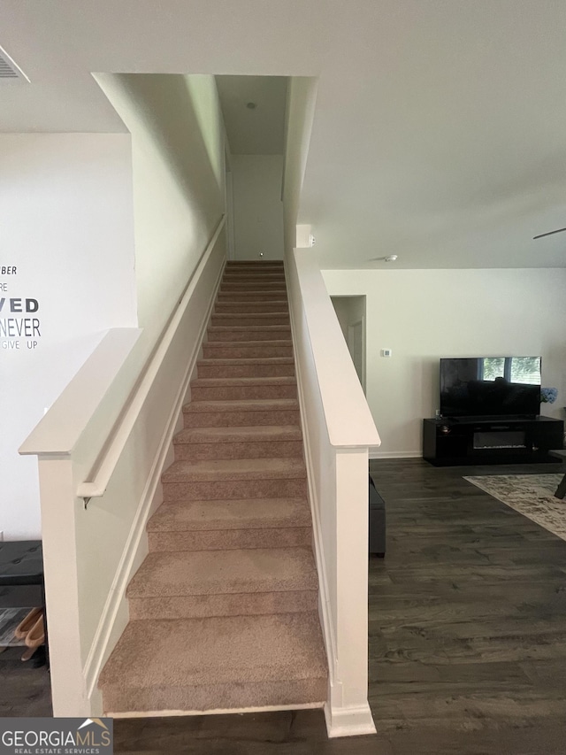 205 Sullivan St, Hampton, GA 30228 - stairs featuring wood finished floors