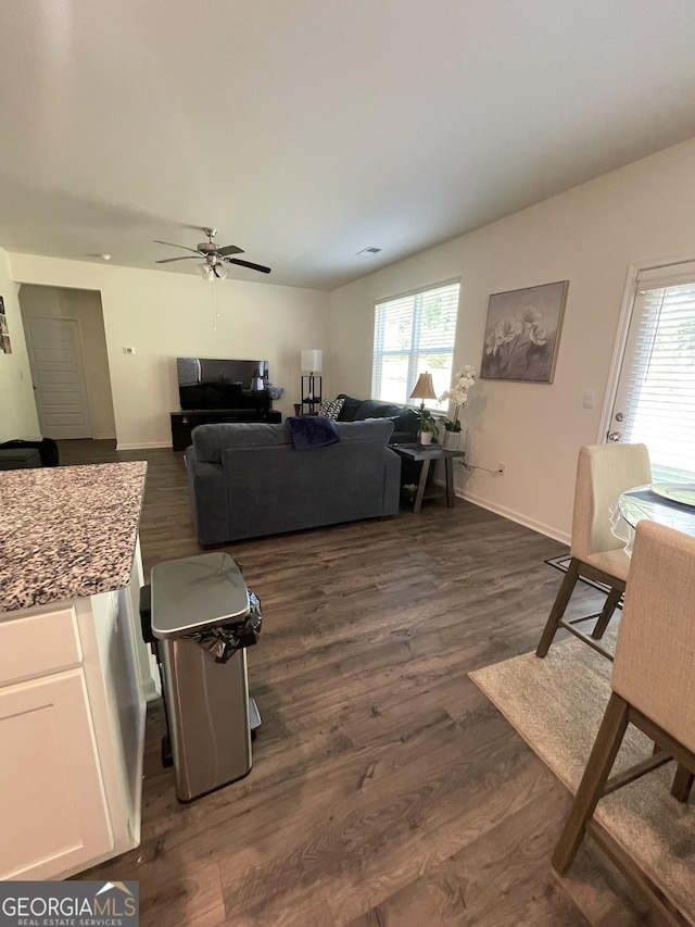 205 Sullivan St, Hampton, GA 30228 - living room with ceiling fan and dark wood-style floors