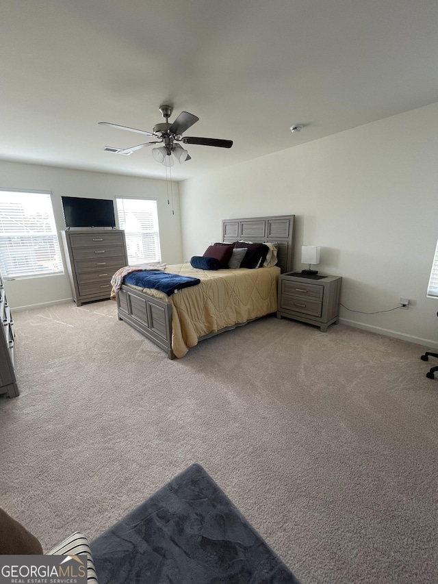 205 Sullivan St, Hampton, GA 30228 - carpeted bedroom with baseboards and ceiling fan