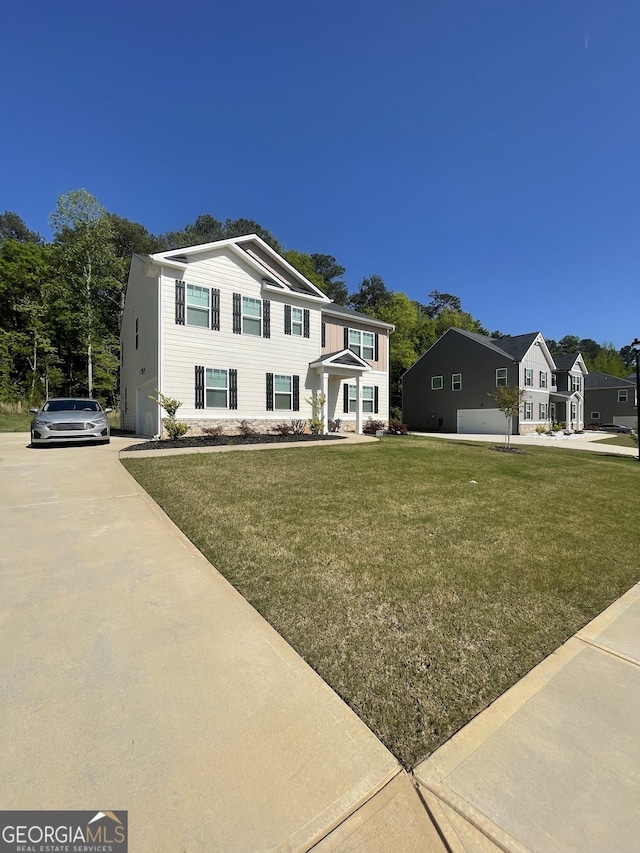 205 Sullivan St, Hampton, GA 30228 - traditional-style home featuring concrete driveway and a front lawn