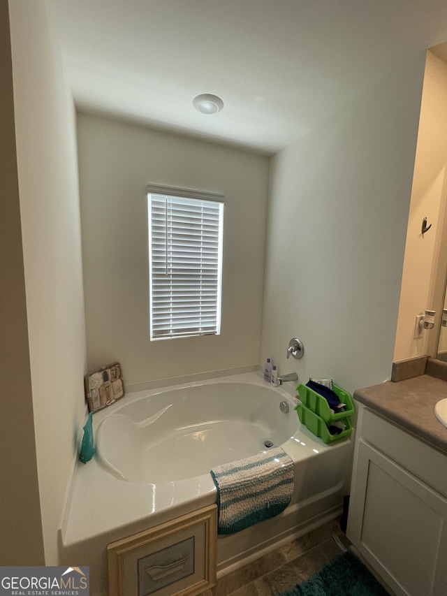 205 Sullivan St, Hampton, GA 30228 - bathroom featuring vanity and a garden tub