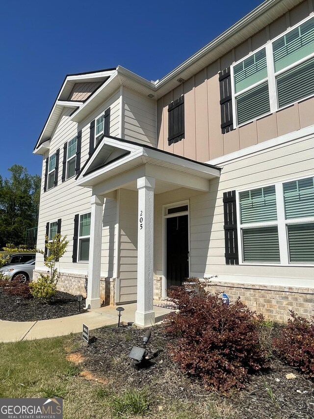 205 Sullivan St, Hampton, GA 30228 - view of front facade with board and batten siding