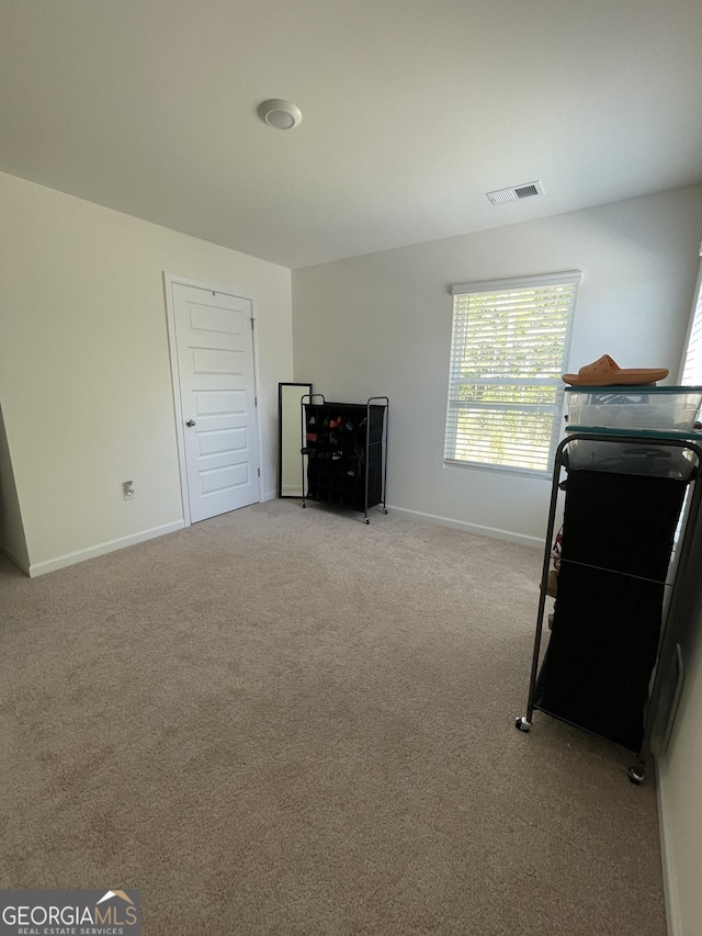 205 Sullivan St, Hampton, GA 30228 - bedroom featuring visible vents, baseboards, and light colored carpet