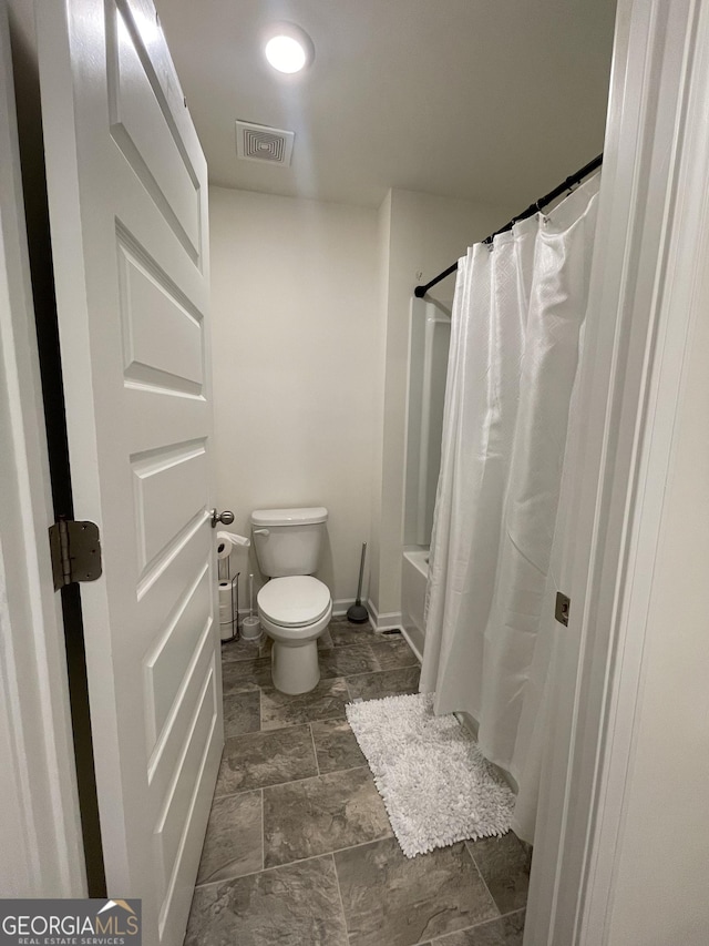 205 Sullivan St, Hampton, GA 30228 - full bathroom featuring toilet and shower / bathtub combination with curtain
