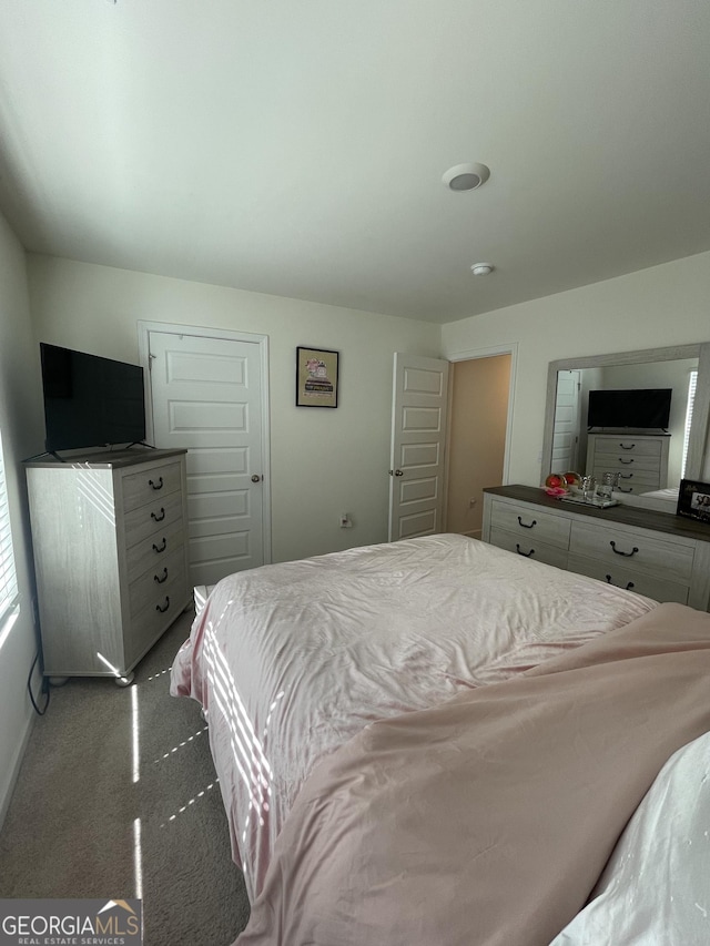 205 Sullivan St, Hampton, GA 30228 - carpeted bedroom featuring baseboards