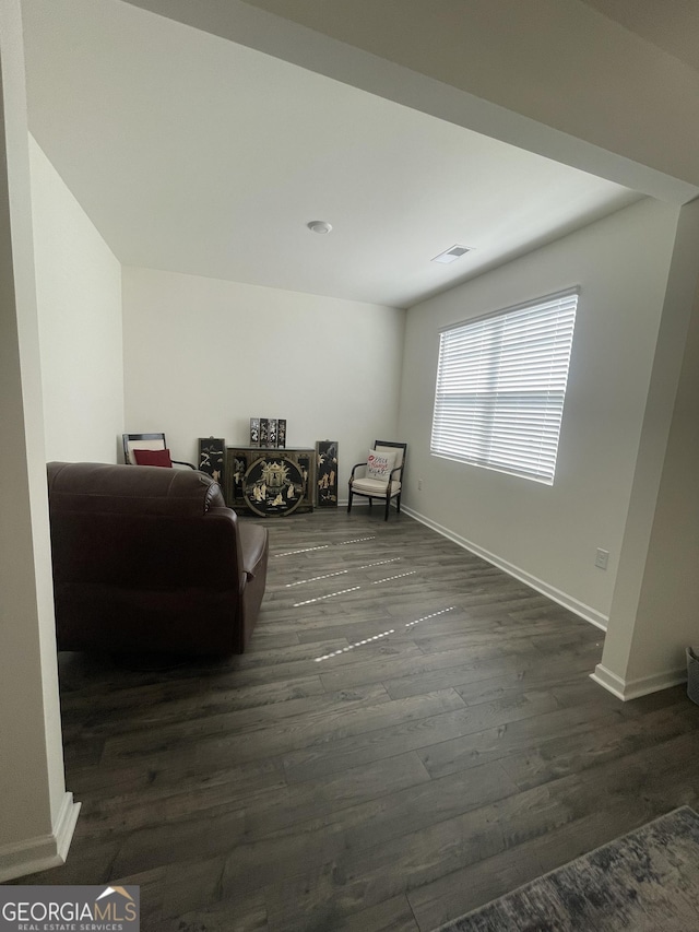 205 Sullivan St, Hampton, GA 30228 - living area featuring dark wood-type flooring and baseboards