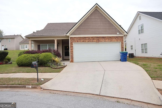 view of front of property featuring central AC, a front yard, stone siding, a garage, and concrete driveway