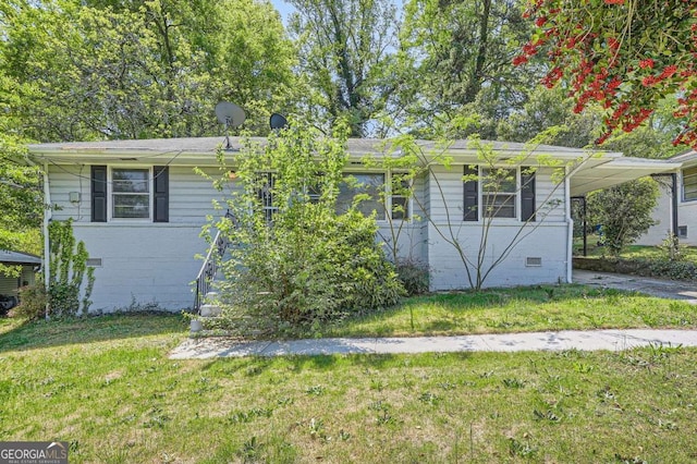 1105 S Parkwood Dr, Forest Park, GA 30297 - ranch-style home featuring a carport, driveway, crawl space, and a front lawn