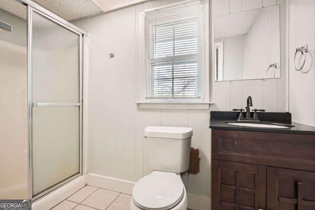 1105 S Parkwood Dr, Forest Park, GA 30297 - full bathroom featuring baseboards, toilet, a shower stall, vanity, and tile patterned flooring