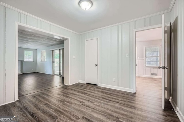 1105 S Parkwood Dr, Forest Park, GA 30297 - unfurnished room featuring dark wood-style floors, baseboards, and crown molding