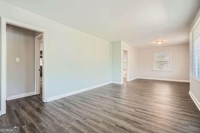 1105 S Parkwood Dr, Forest Park, GA 30297 - empty room with dark wood-style flooring and baseboards
