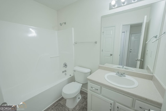 460 Mckneely Rd, Griffin, GA 30224 - full bath featuring vanity, toilet, shower / bath combination, tile patterned floors, and baseboards