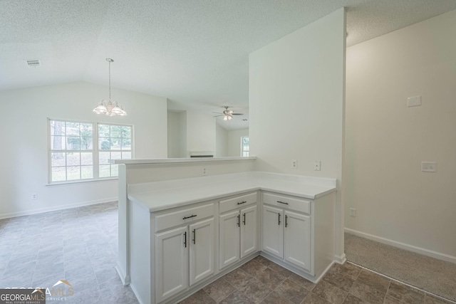 460 Mckneely Rd, Griffin, GA 30224 - kitchen with ceiling fan with notable chandelier, a textured ceiling, visible vents, white cabinets, and baseboards
