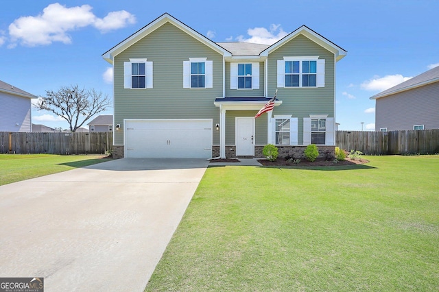 view of front of house with an attached garage, concrete driveway, fence, and a front lawn