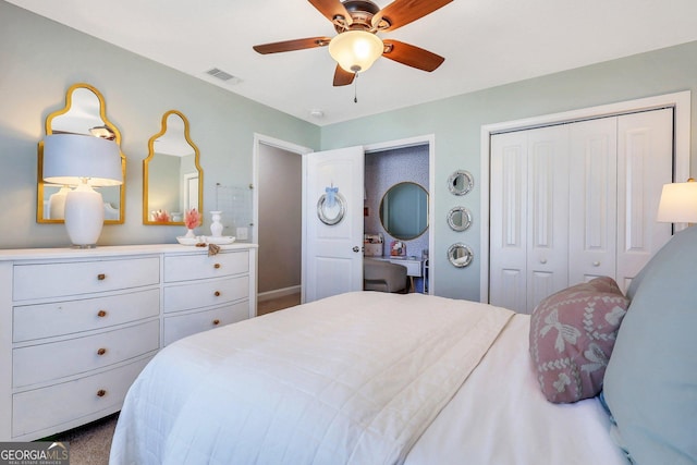 carpeted bedroom with visible vents, a ceiling fan, and two closets