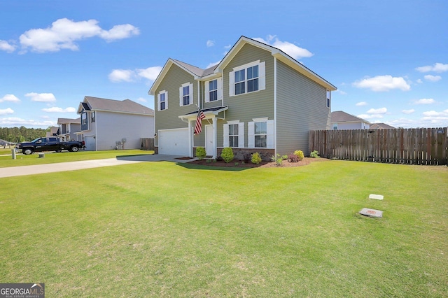 view of front facade featuring an attached garage, fence, driveway, and a front lawn