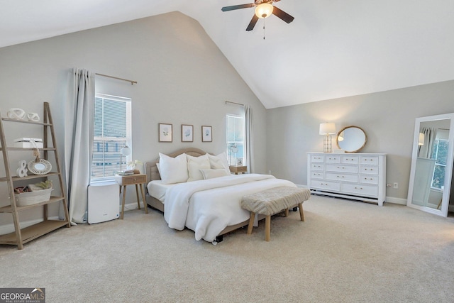 carpeted bedroom with high vaulted ceiling, baseboards, and a ceiling fan