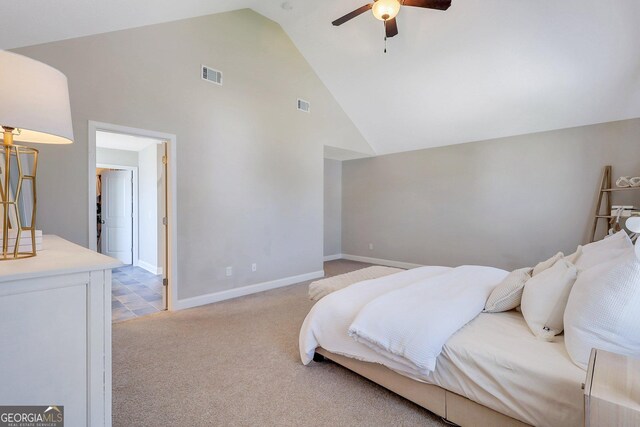 bedroom featuring light carpet, high vaulted ceiling, visible vents, and baseboards