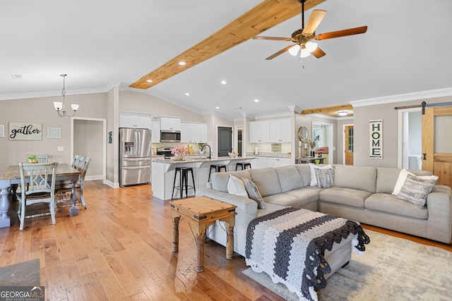 75 Flagstone Dr, Newnan, GA 30263 - living room with a chandelier, ceiling fan, a barn door, light wood-type flooring, and recessed lighting