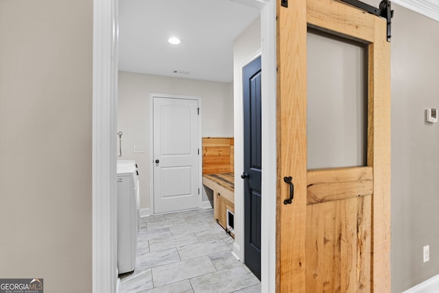 75 Flagstone Dr, Newnan, GA 30263 - hall featuring washing machine and dryer, a barn door, and recessed lighting