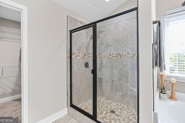 75 Flagstone Dr, Newnan, GA 30263 - full bath with a garden tub, a shower stall, a spacious closet, and lofted ceiling