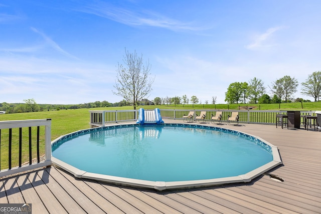 75 Flagstone Dr, Newnan, GA 30263 - outdoor pool featuring a wooden deck and a yard