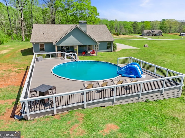 75 Flagstone Dr, Newnan, GA 30263 - outdoor pool with a deck and a yard
