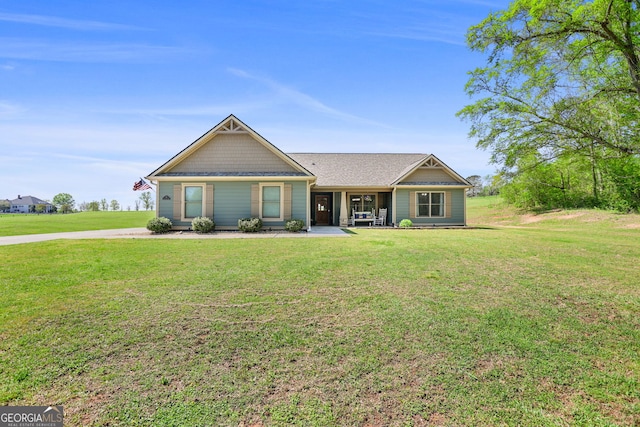 75 Flagstone Dr, Newnan, GA 30263 - view of front facade featuring a front lawn and roof with shingles
