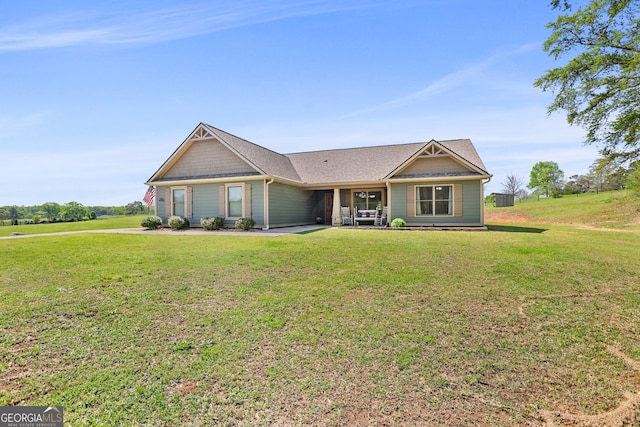 75 Flagstone Dr, Newnan, GA 30263 - view of front facade featuring a front yard, a patio area, and a shingled roof