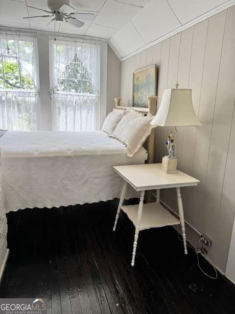 bedroom featuring vaulted ceiling and hardwood / wood-style floors