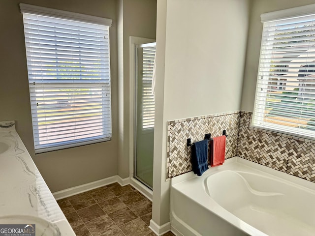 141 Macalester Dr, Newnan, GA 30265 - bathroom with a bath, plenty of natural light, and a shower with door