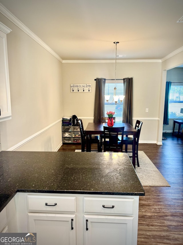 141 Macalester Dr, Newnan, GA 30265 - dining room featuring dark wood-type flooring and crown molding