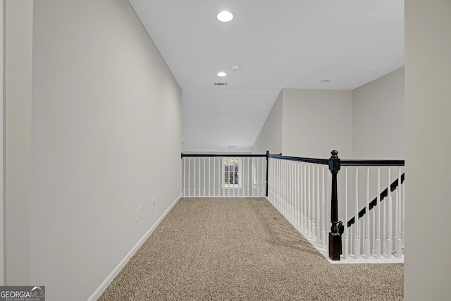 hallway featuring recessed lighting, baseboards, visible vents, and carpet