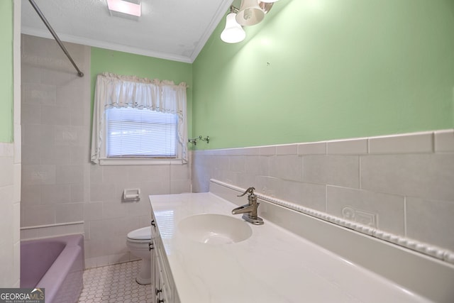 482 E Lake Rd, Mcdonough, GA 30252 - bathroom featuring crown molding, tile patterned floors, vanity, tile walls, and toilet