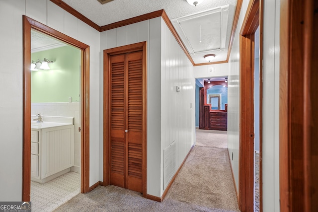 482 E Lake Rd, Mcdonough, GA 30252 - hallway with attic access, carpet, baseboards, ornamental molding, and visible vents