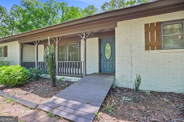 482 E Lake Rd, Mcdonough, GA 30252 - view of exterior entry featuring brick siding and covered porch