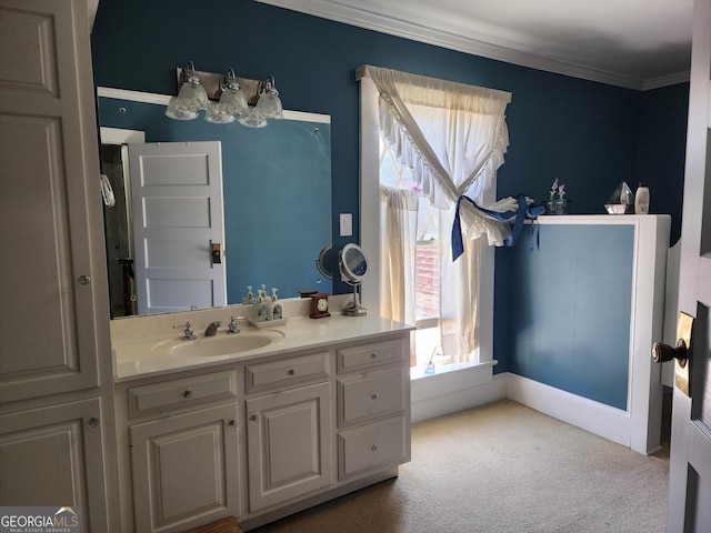 bathroom featuring crown molding and vanity