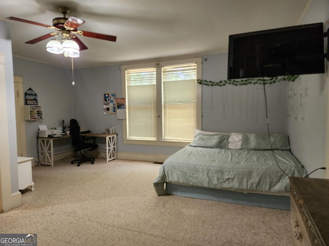 bedroom with a ceiling fan and carpet floors