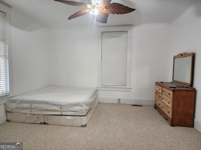 carpeted bedroom featuring visible vents and ceiling fan
