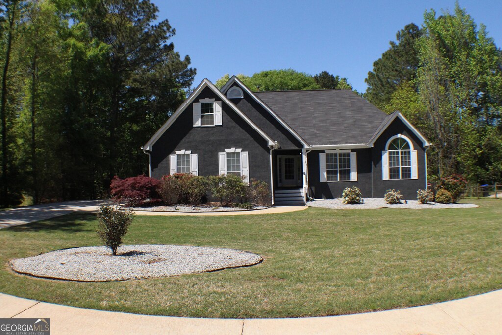545 Chaseridge Dr, Mcdonough, GA 30253 - view of front of house featuring a front lawn