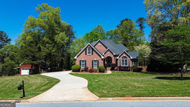 2319 Lochinver Ln SW, Conyers, GA 30094 - traditional-style house featuring brick siding, a front lawn, and driveway