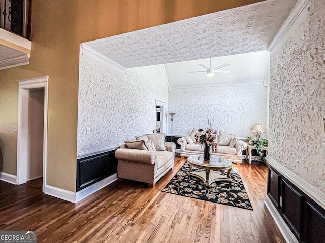 2319 Lochinver Ln SW, Conyers, GA 30094 - living room featuring ornamental molding, wood finished floors, ceiling fan, and wallpapered walls