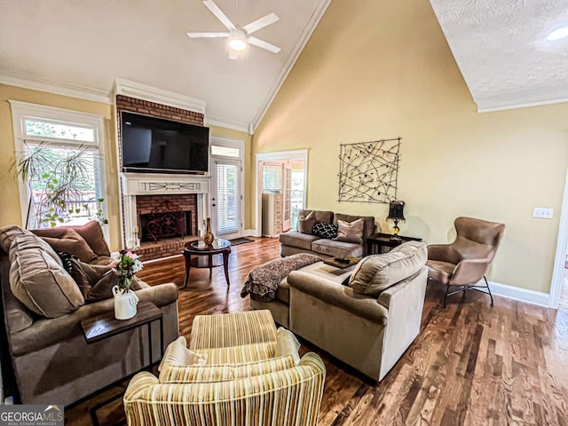 2319 Lochinver Ln SW, Conyers, GA 30094 - living room with a ceiling fan, baseboards, a brick fireplace, ornamental molding, and wood finished floors