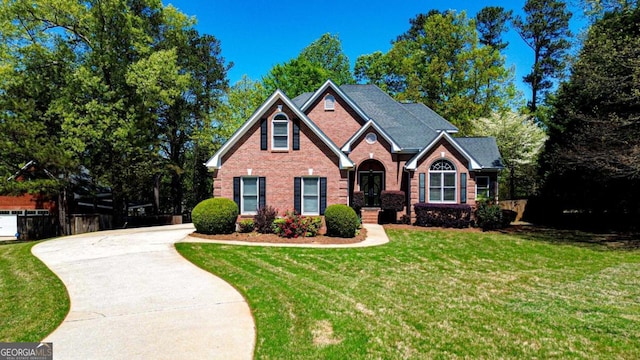 2319 Lochinver Ln SW, Conyers, GA 30094 - traditional-style home featuring brick siding and driveway