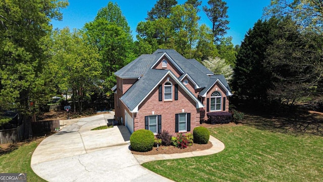 2319 Lochinver Ln SW, Conyers, GA 30094 - view of front of property featuring driveway, brick siding, and a garage
