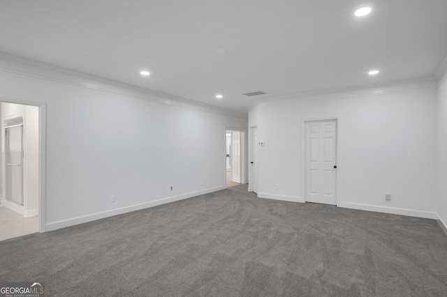 interior space featuring dark carpet, baseboards, ornamental molding, and recessed lighting