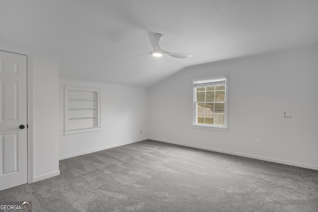 bonus room with built in features, baseboards, a ceiling fan, carpet floors, and lofted ceiling